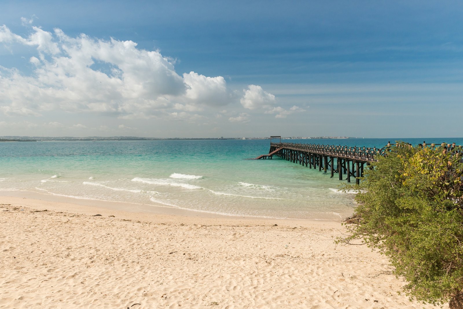 Benson Safaris | beautiful Zanzibar beach with pier in ocean