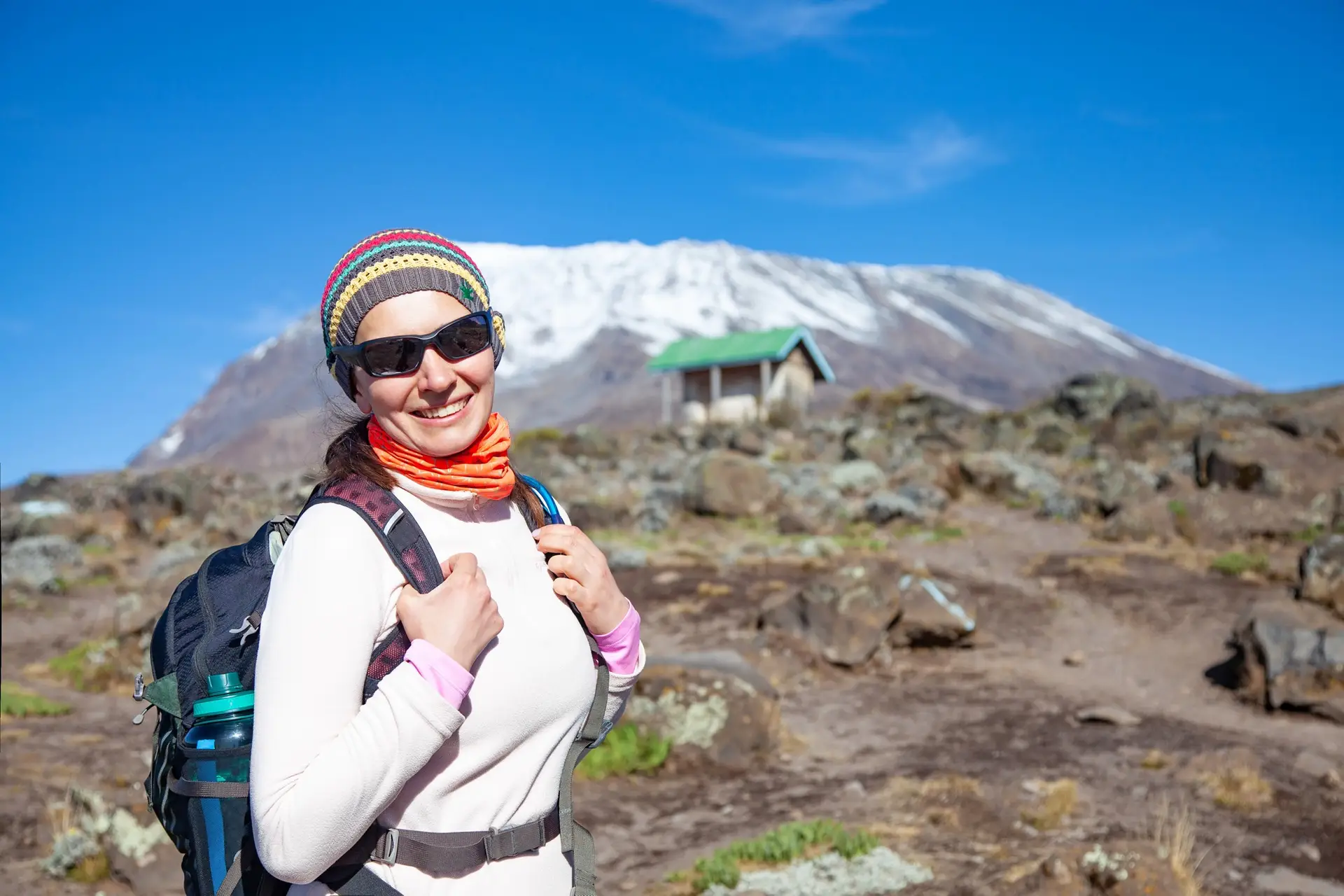 Female backpacker on the trek to Kilimanjaro mountain