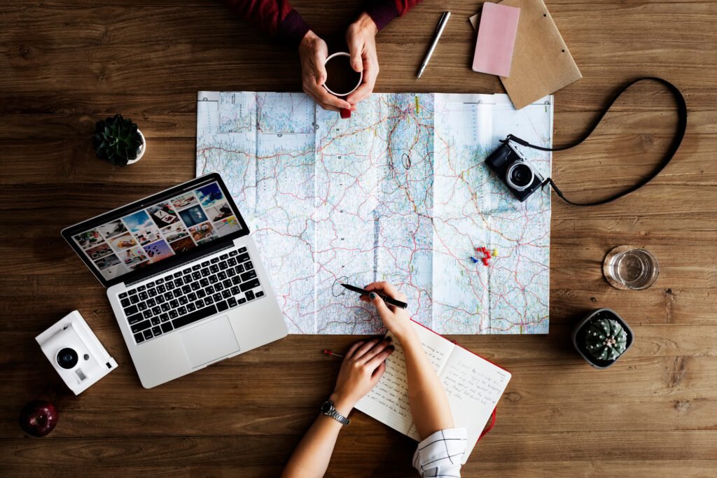 Benson Safaris | Travellers planning a trip on a map