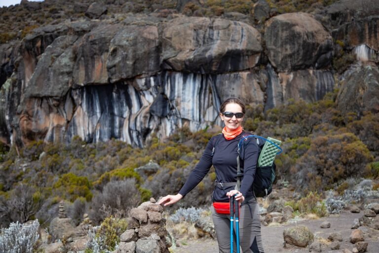 Female backpacker on the trek to Kilimanjaro mountain