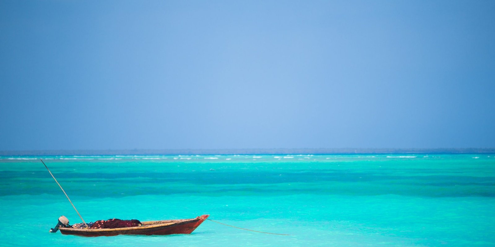 Benson Safaris | Wooden fishing boat on sea of Zanzibar Island